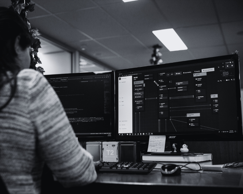 A male software developer assesses computer code.