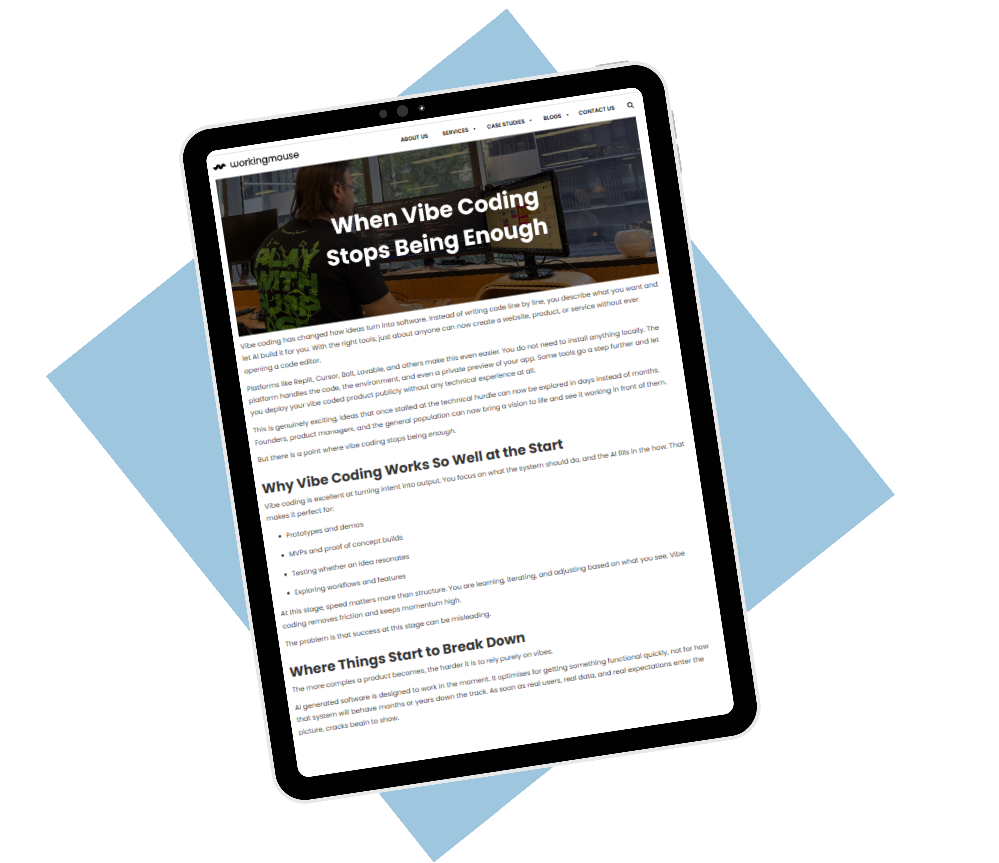 Angled tablet mockup displaying a WorkingMouse blog article titled “When Vibe Coding Stops Being Enough,” showing a developer working at a desk with code on a monitor, set against a dark background with blue geometric shapes.