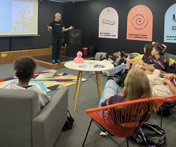 WorkingMouse CEO, Eban Escott, is photographed speaking to students