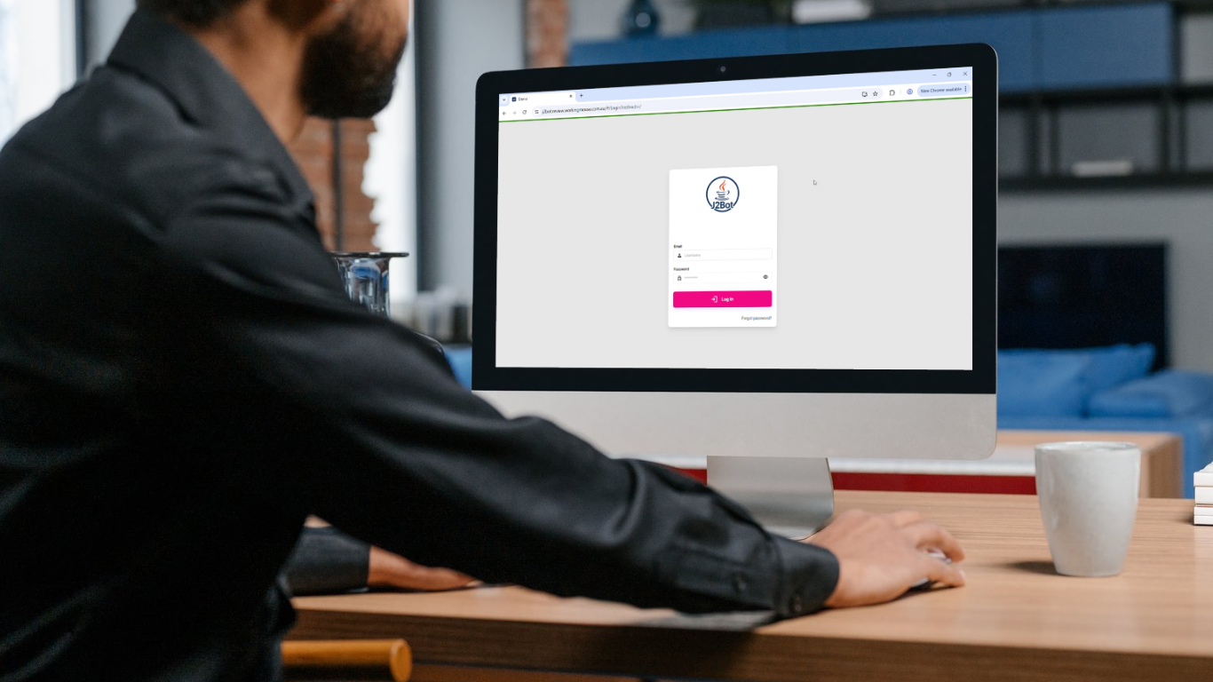 Man using computer with the J2Bot application 