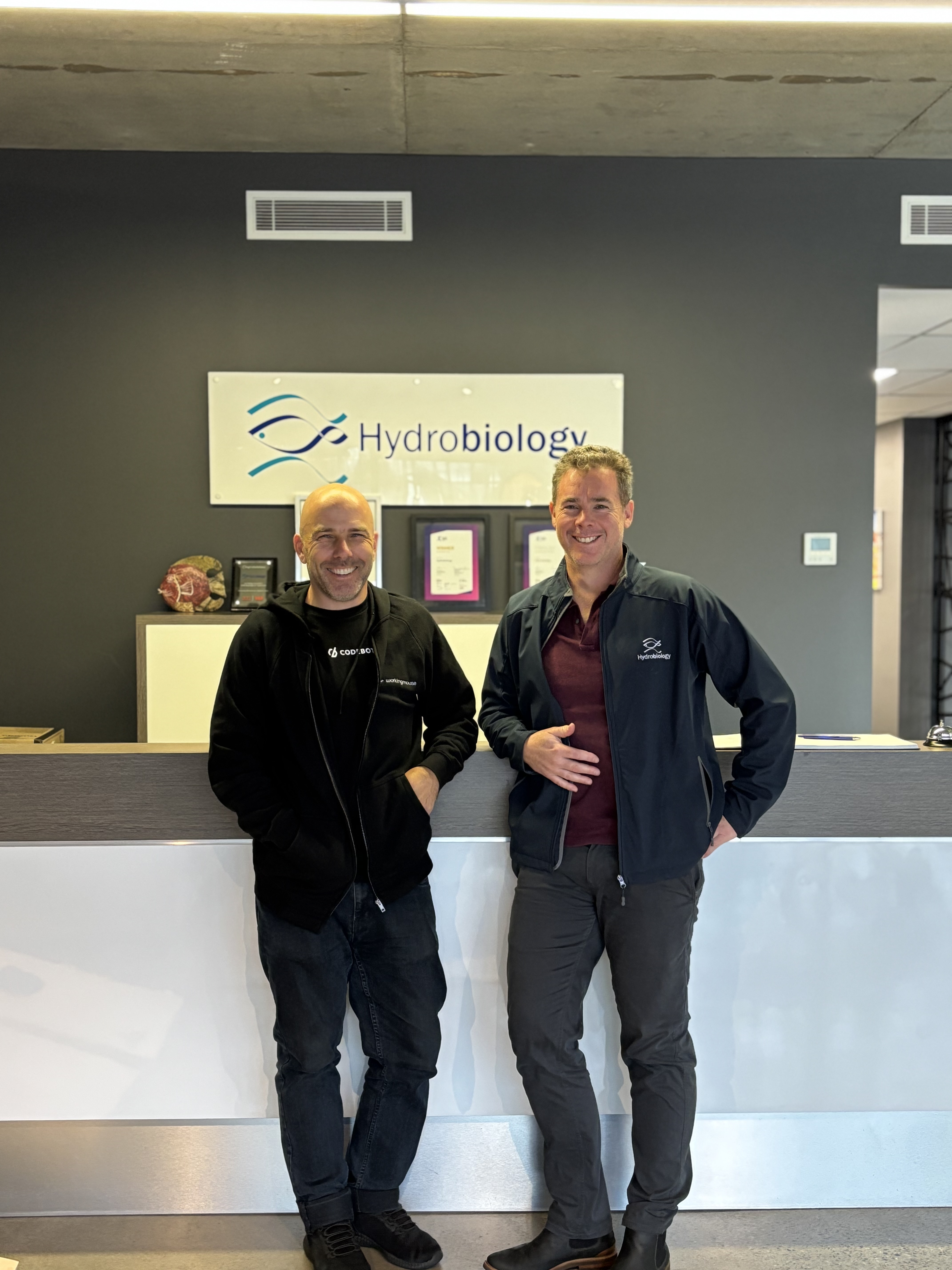 Eban and Simon stanfing infront of the Hydrobiology logo