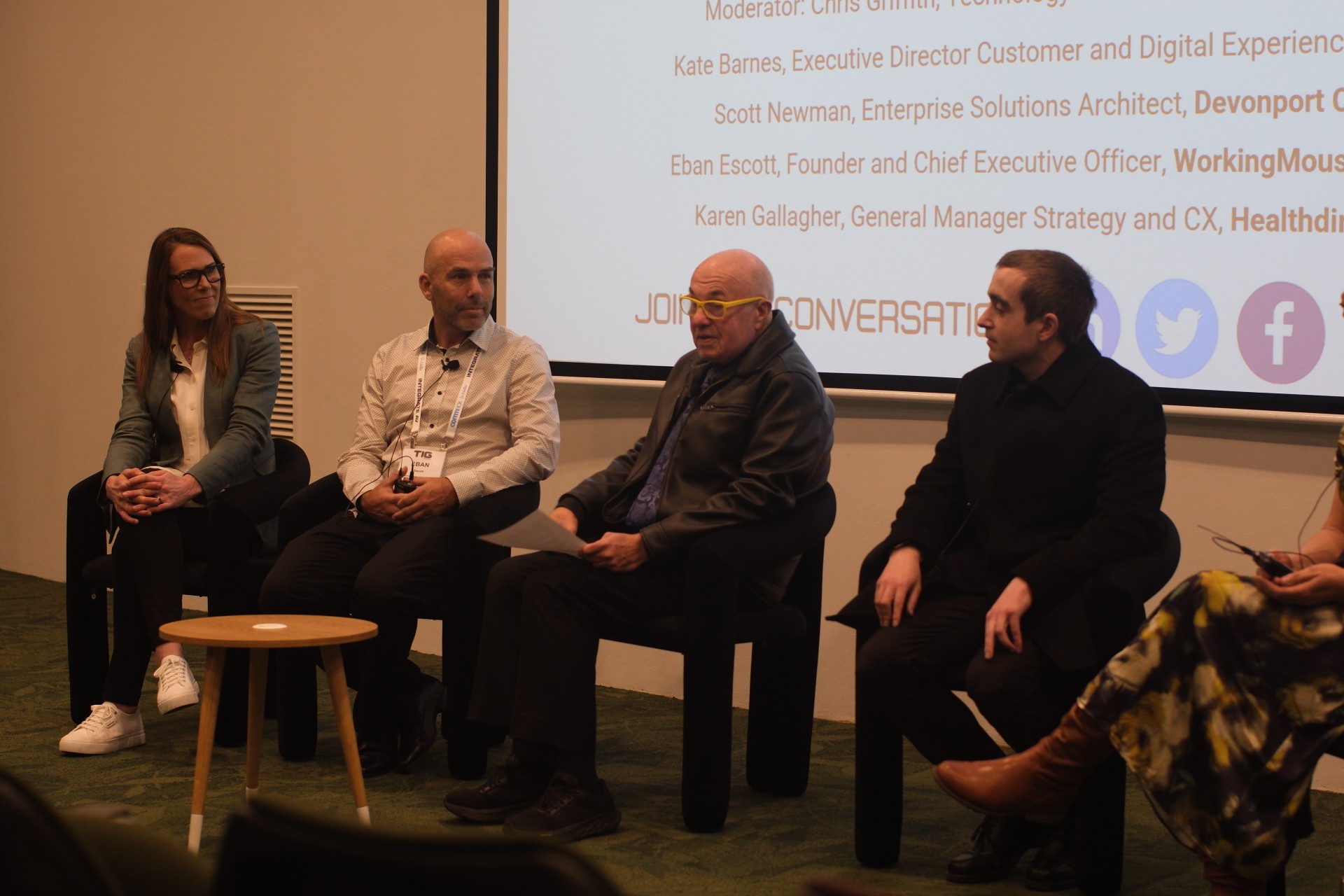 A photo of Eban Escott and other panelists at Tech in Gov