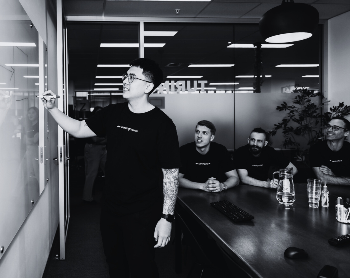 Man writing on whiteboard