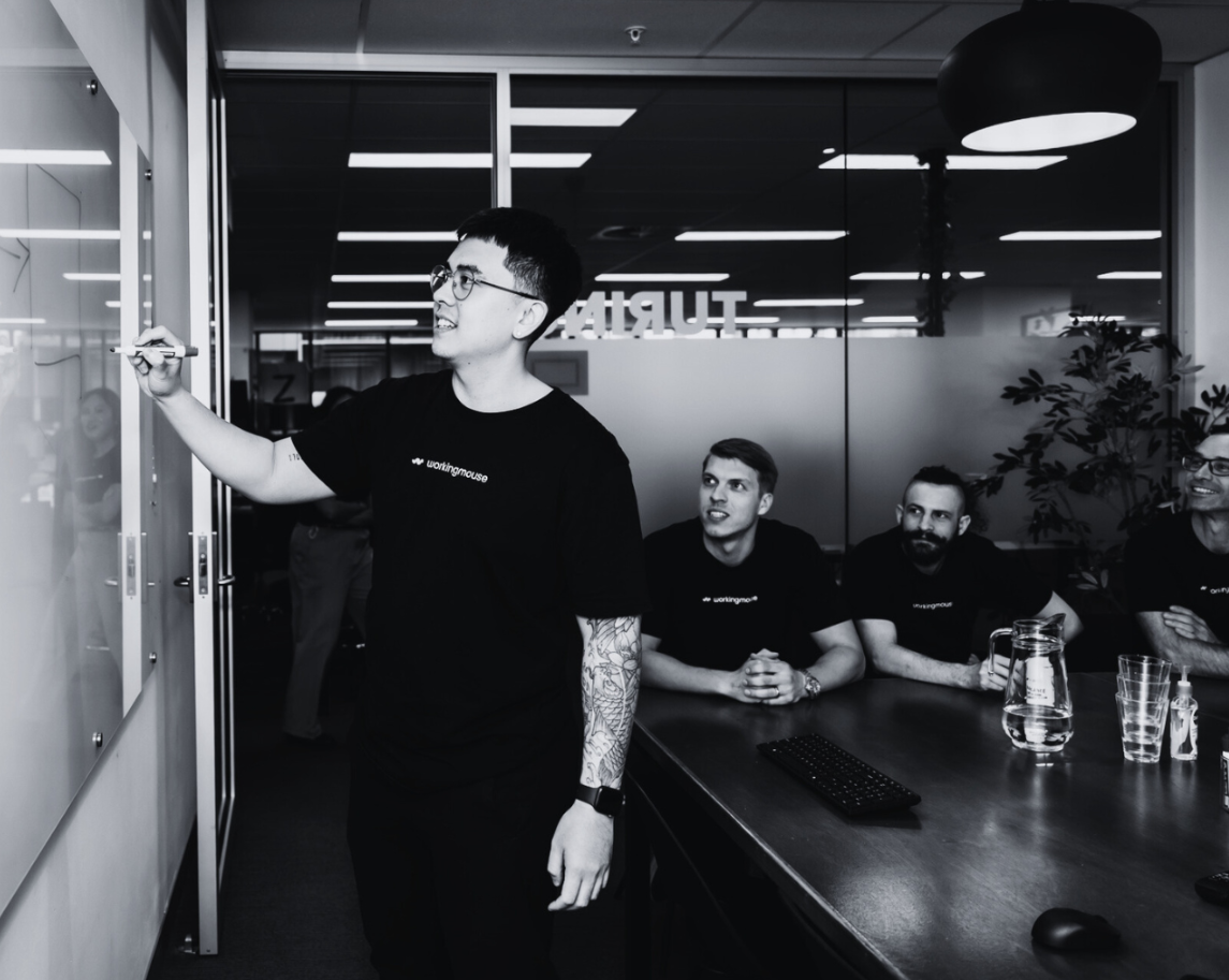 Man writing on whiteboard